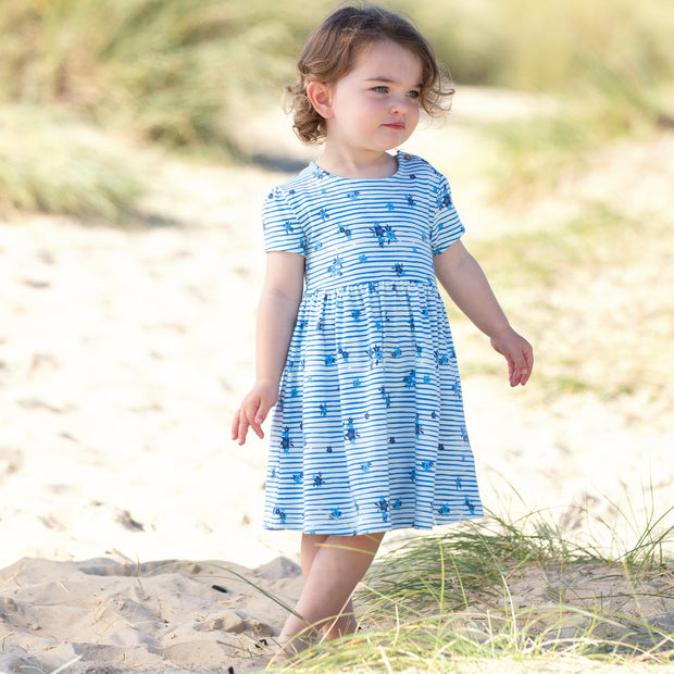 Girl in stripy ditsy dress