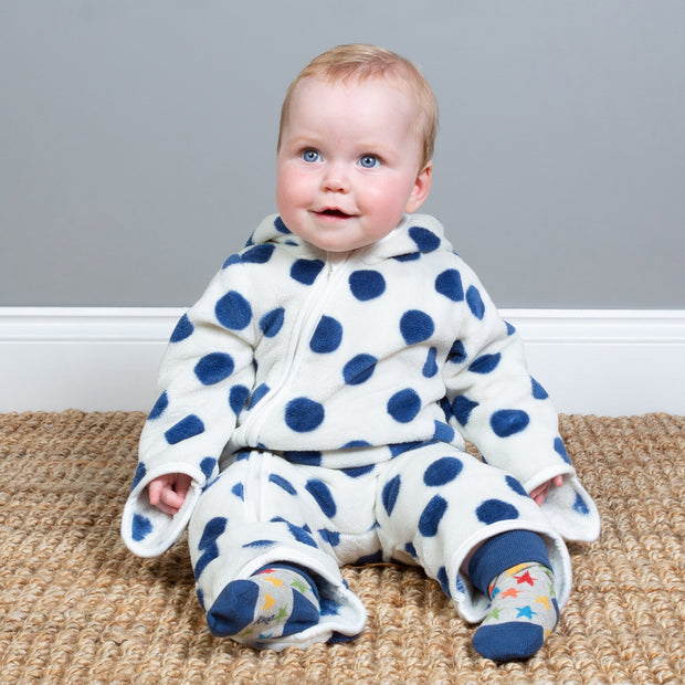 Baby in dotty fleece onesie