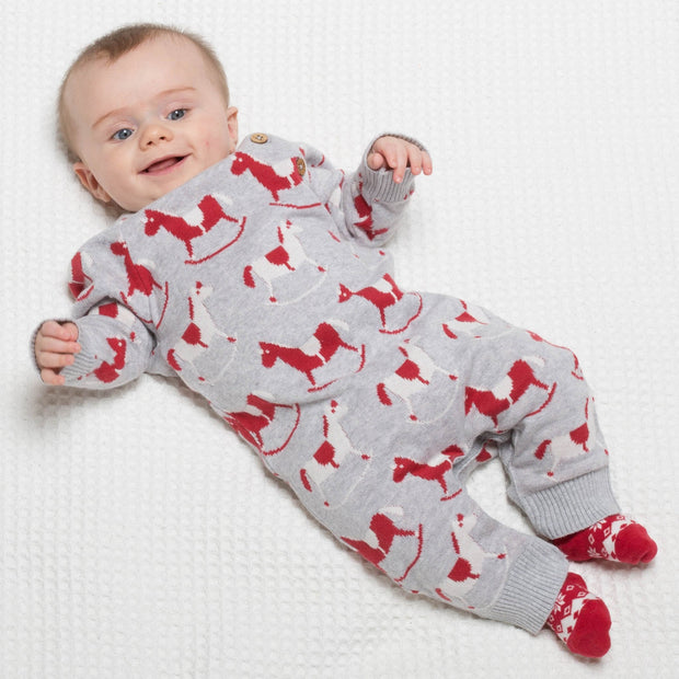 Baby in rocking horse romper