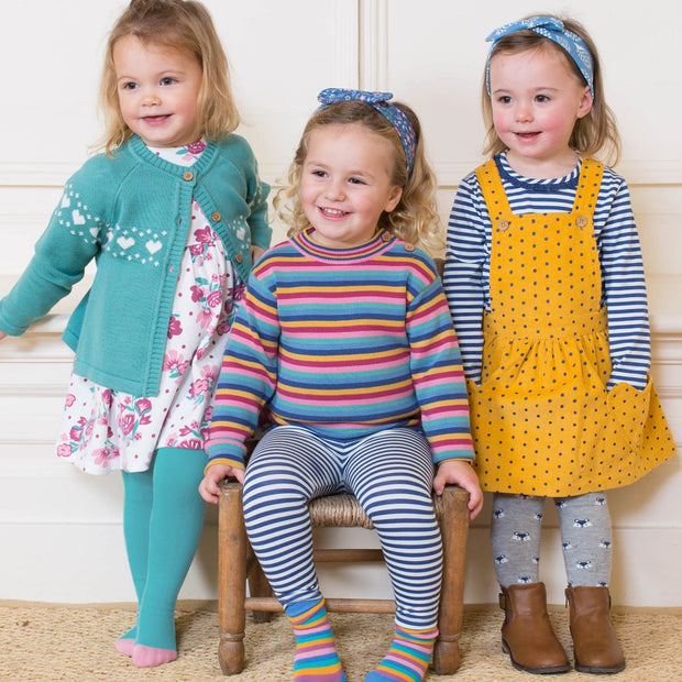 Girl in polka heart pinafore