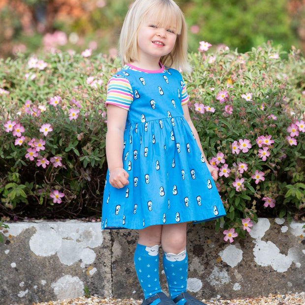 Girl in seahorse stripe dress